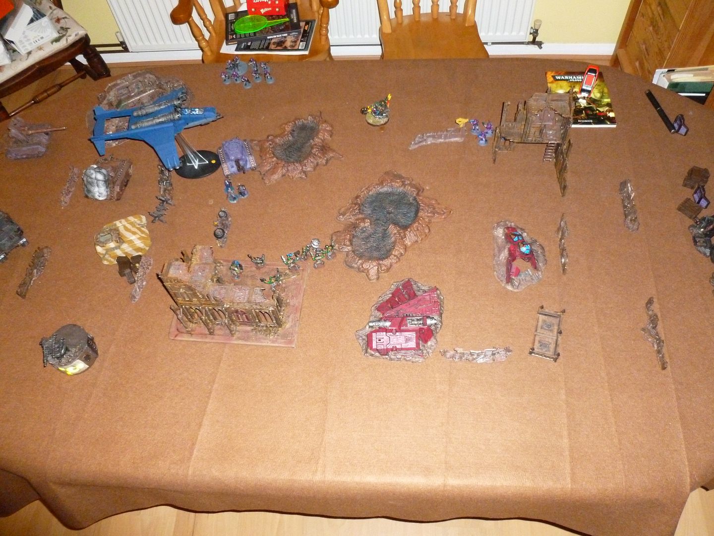 The final turn of a game of 40k vs my sister. Despite being almost tabled the orks siezed a victory.
